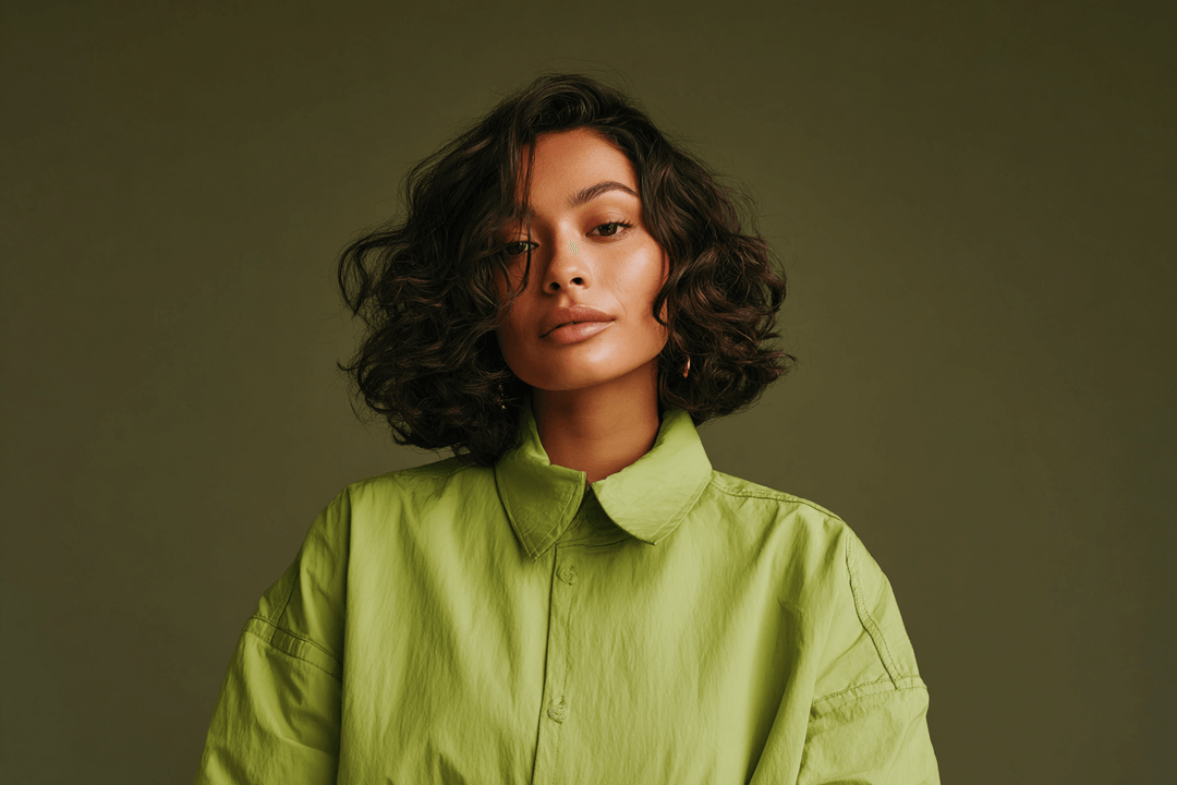 Established hairstylist in a lime shirt