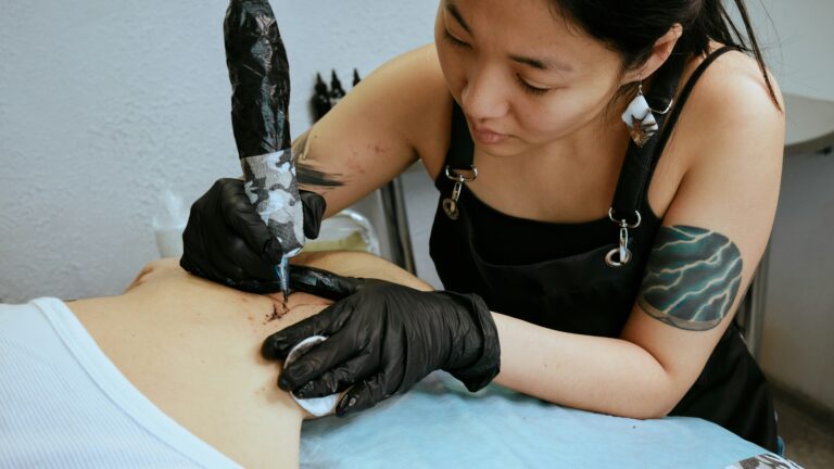 tattoo artist working